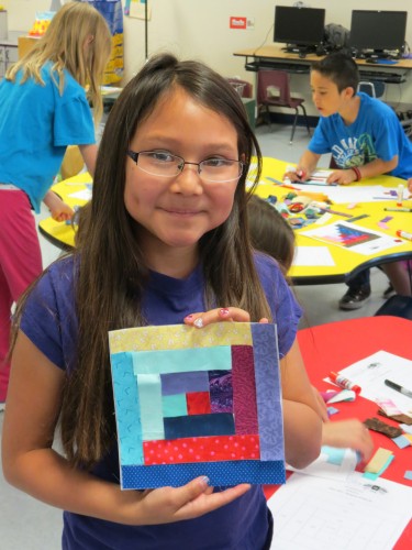 Students with random lights and dark in her quilt block.